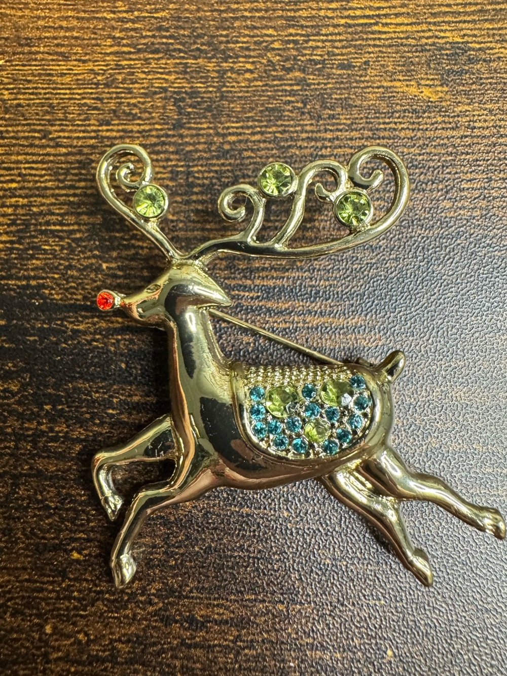 Gold-Tone Reindeer Brooch with Green and Blue Rhinestone Accents
